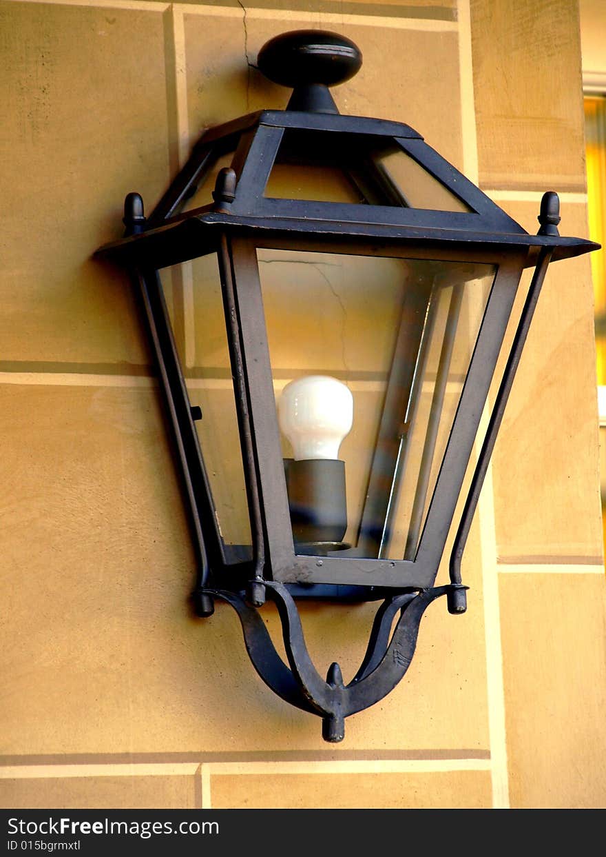 A good close up of a lamp on a wall
