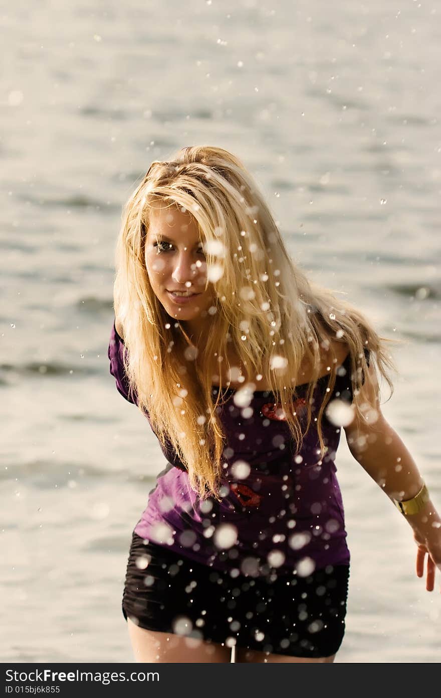 Beatiful girl under water drops