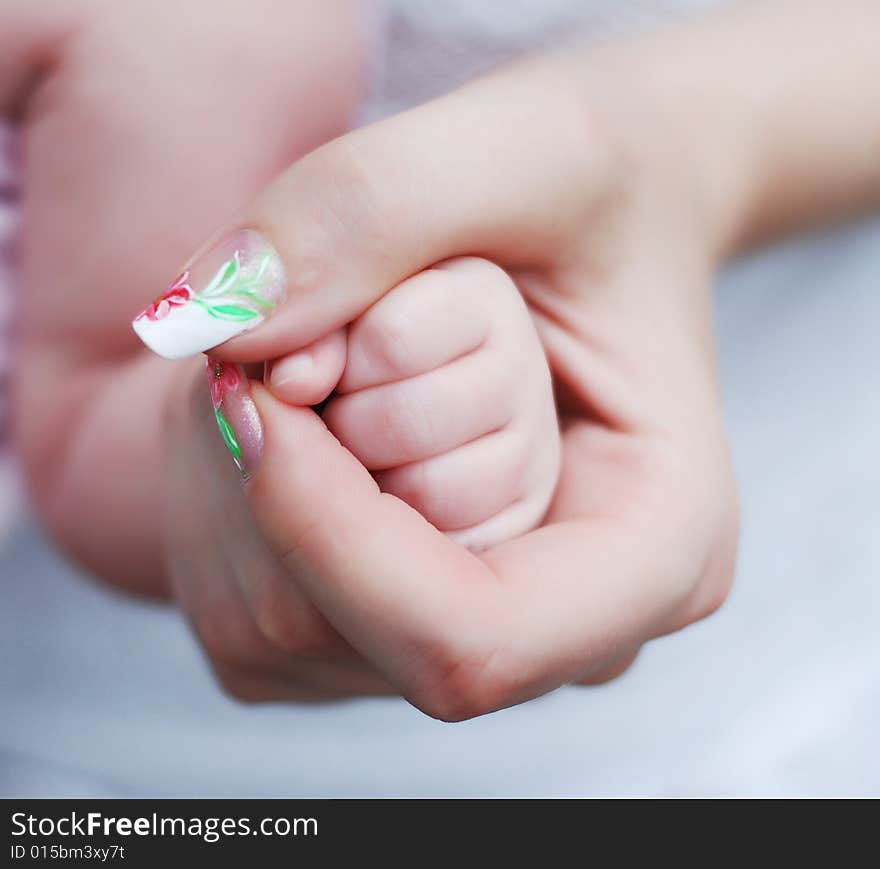 Little cute child's hand in mother's hand. Little cute child's hand in mother's hand