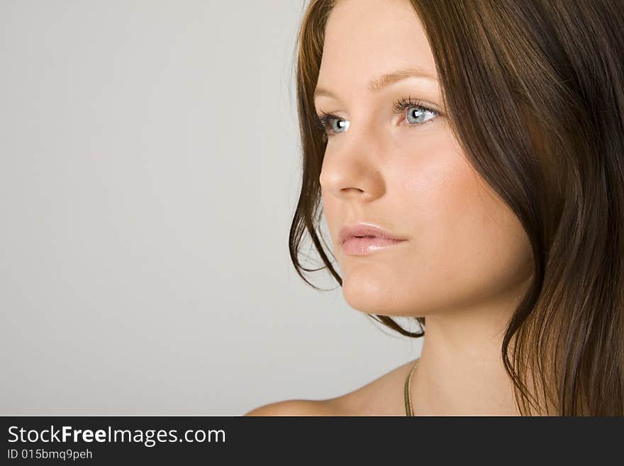 Young beautiful woman portrait on white background