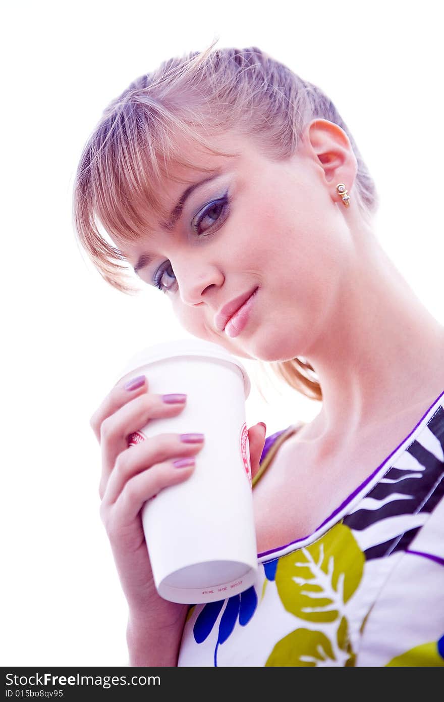 Smiling lovely young woman drinking coffee outside. Smiling lovely young woman drinking coffee outside