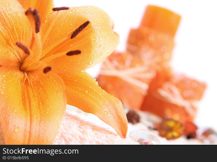 Orange lilly flower and candles. Orange lilly flower and candles