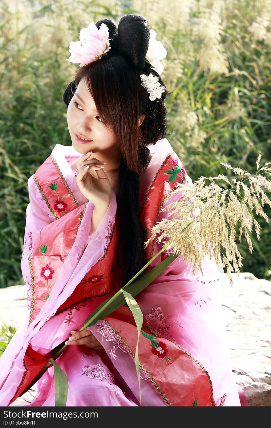 A girl in Chinese ancient dress. She is so beautiful and lovely. A girl in Chinese ancient dress. She is so beautiful and lovely.