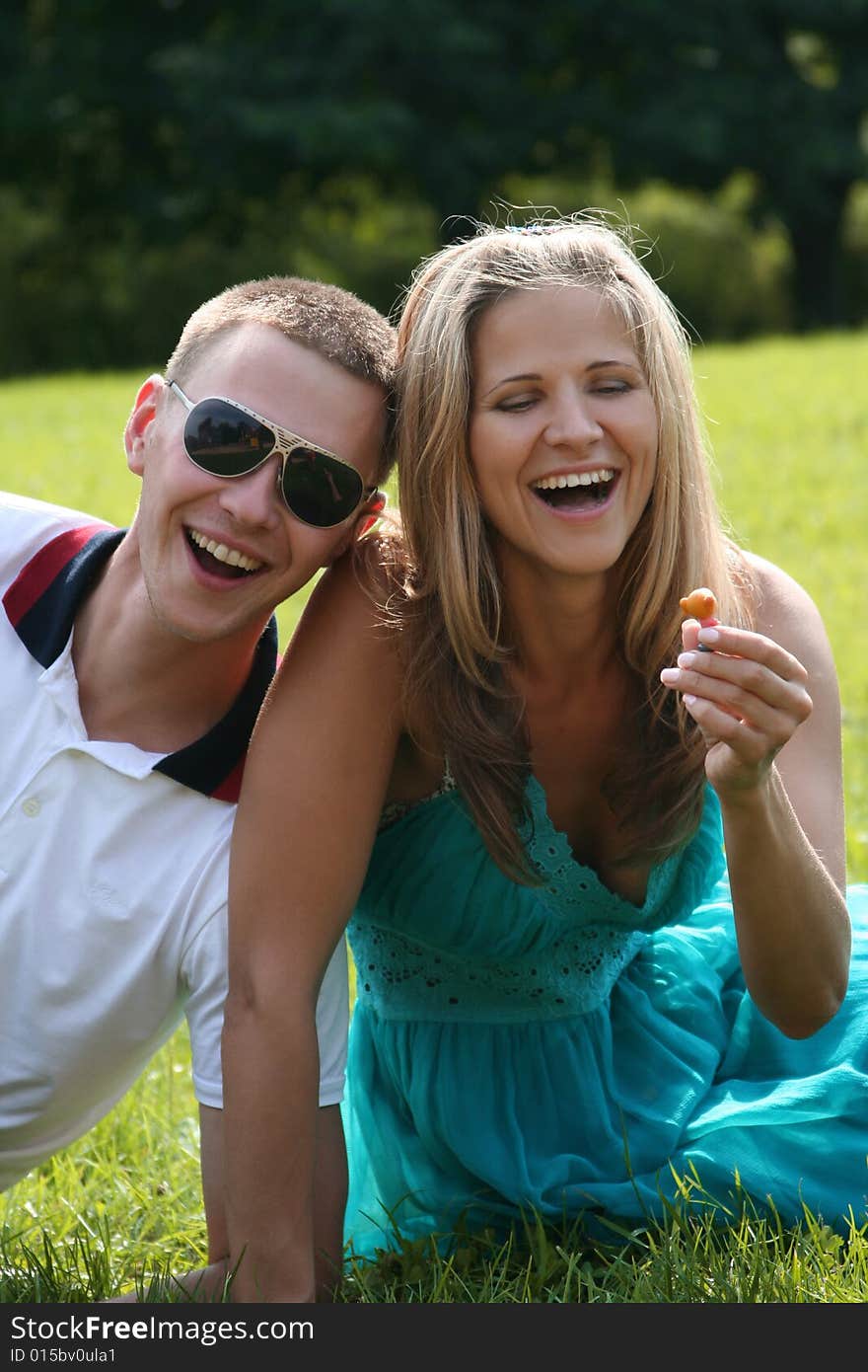 Happy young couple having fun in park