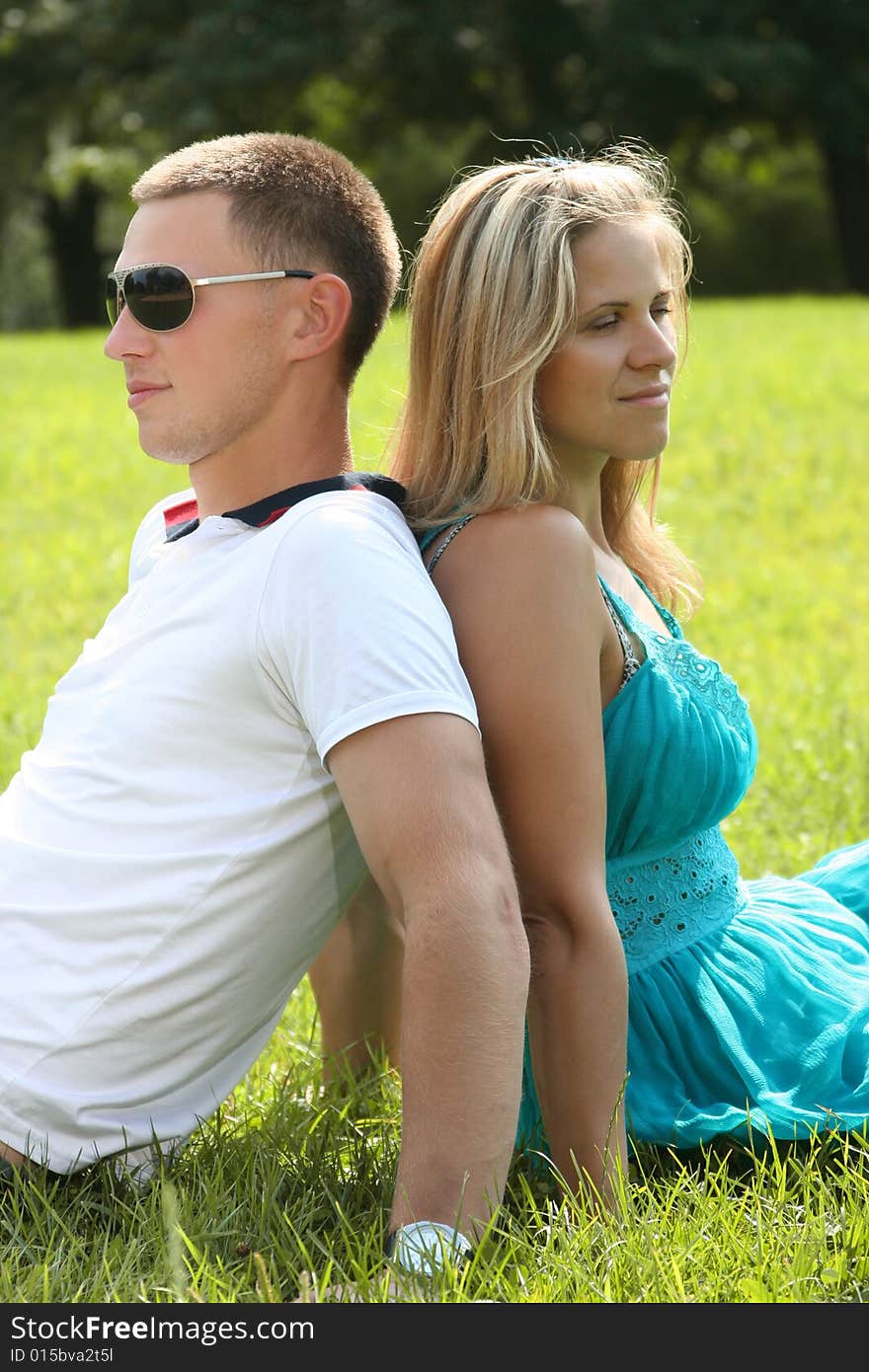 Happy young couple relaxing in park