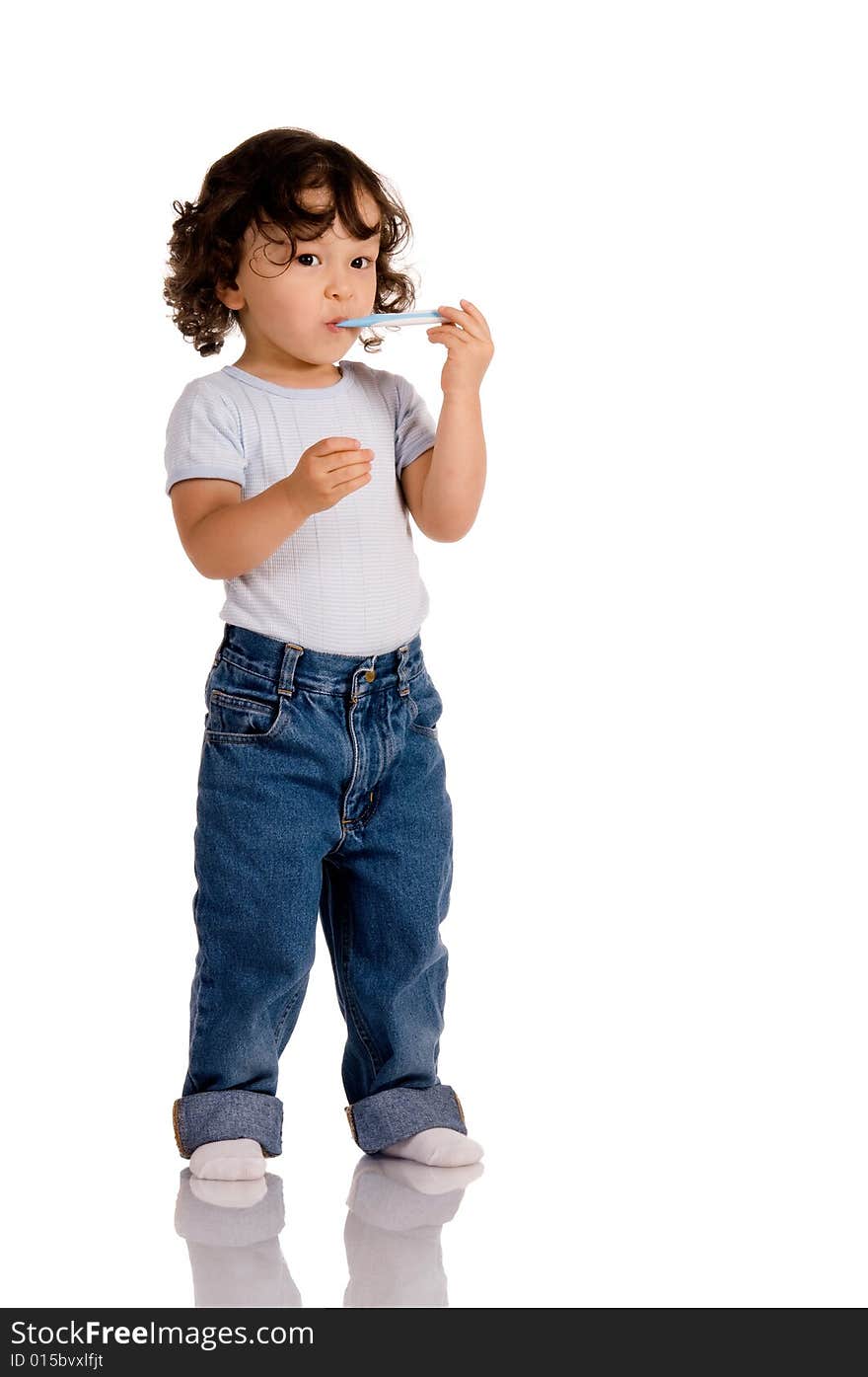 Child with toothbrush on white