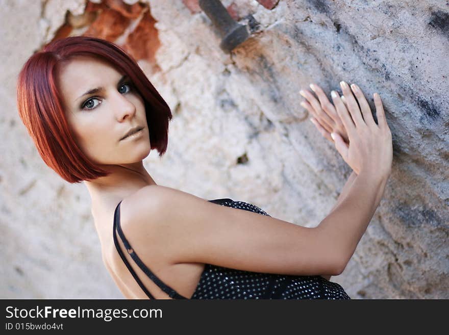 young girl near old wall. young girl near old wall