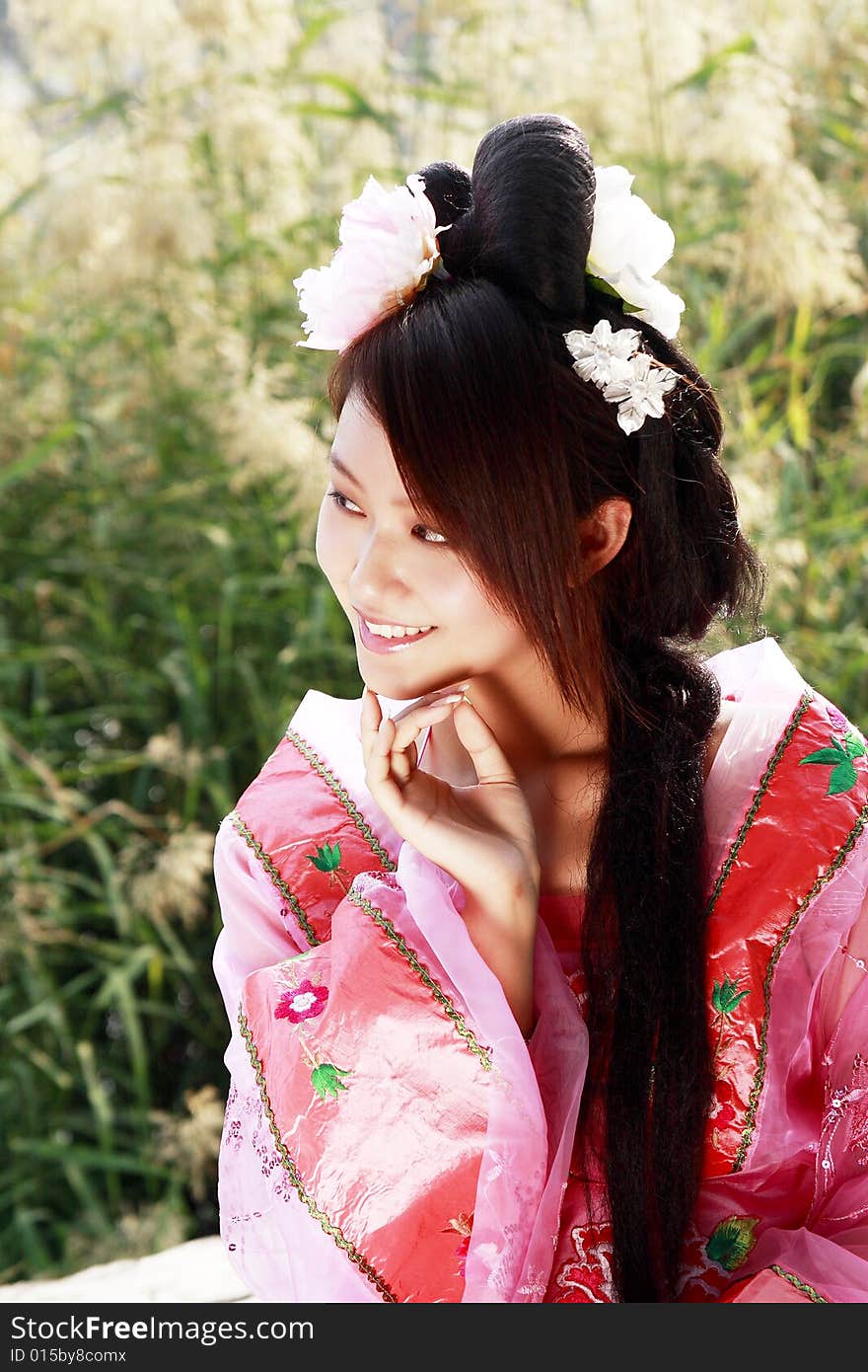 A girl in Chinese ancient dress. She is so beautiful and lovely. A girl in Chinese ancient dress. She is so beautiful and lovely.