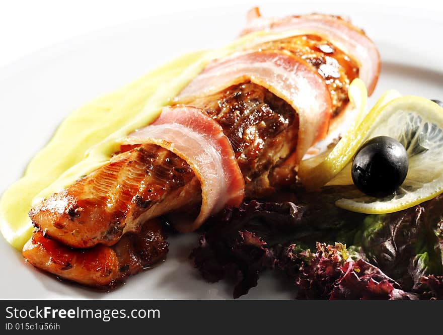 Salmon Steak in Bacon with Lemon Sauce. Isolated on White Background