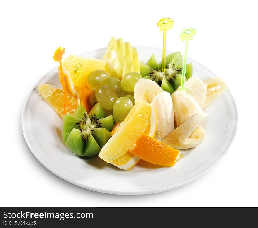 Fresh Sliced Fruit Plate (Banana, Kiwi, Pineapple, Apple, Grapes). Isolated on White Background