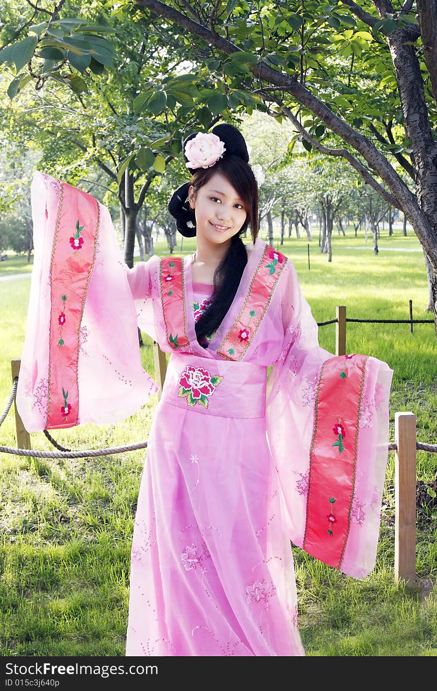 A girl in Chinese ancient dress. She is so beautiful and lovely. A girl in Chinese ancient dress. She is so beautiful and lovely.