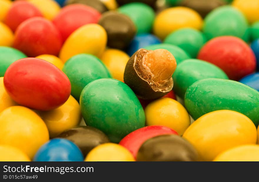 Colorful candies with a nut