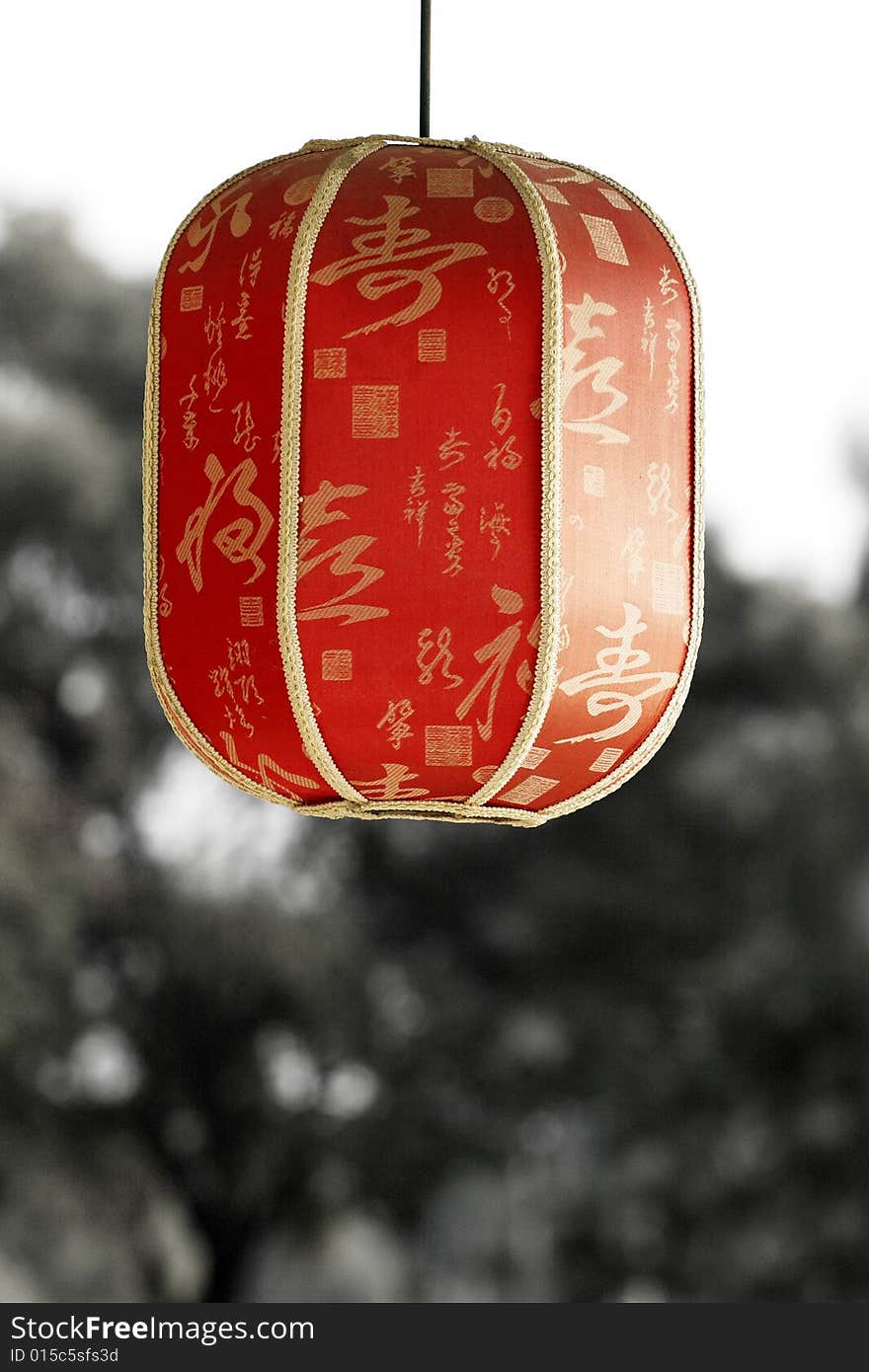 Red lantern under the setting sun. Chinese on the lantern is the ancient poesy of China, the main idea is the praise of tea culture.