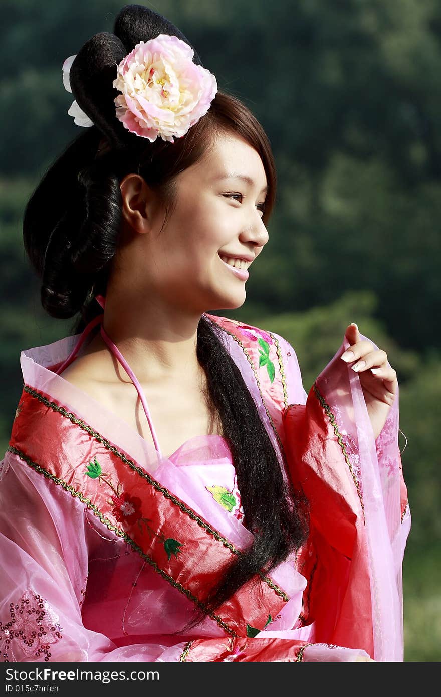 A girl in Chinese ancient dress. She is so beautiful and lovely. A girl in Chinese ancient dress. She is so beautiful and lovely.