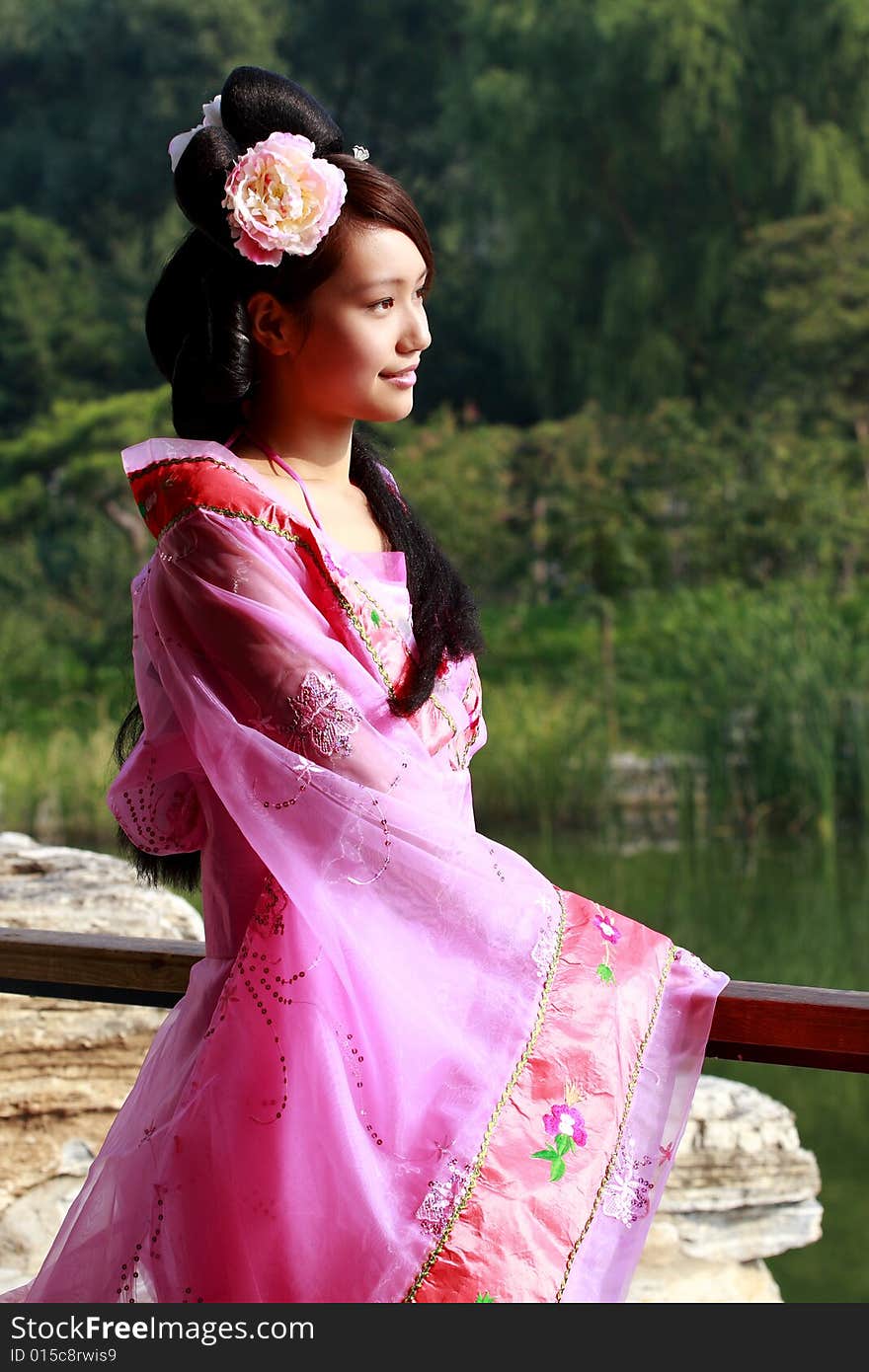 A girl in Chinese ancient dress. She is so beautiful and lovely. A girl in Chinese ancient dress. She is so beautiful and lovely.