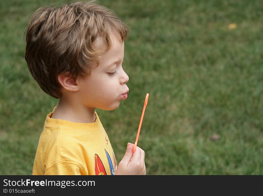 Boy blowing bubbles