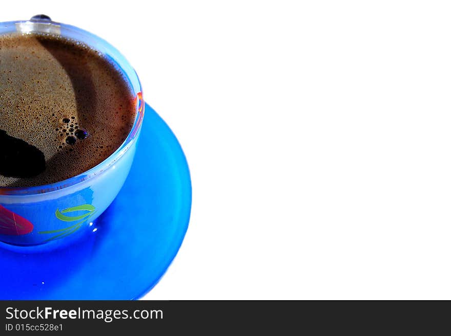 Blue cup of coffee against a white background. Blue cup of coffee against a white background.