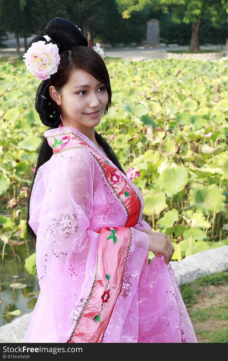 A girl in Chinese ancient dress. She is so beautiful and lovely. A girl in Chinese ancient dress. She is so beautiful and lovely.