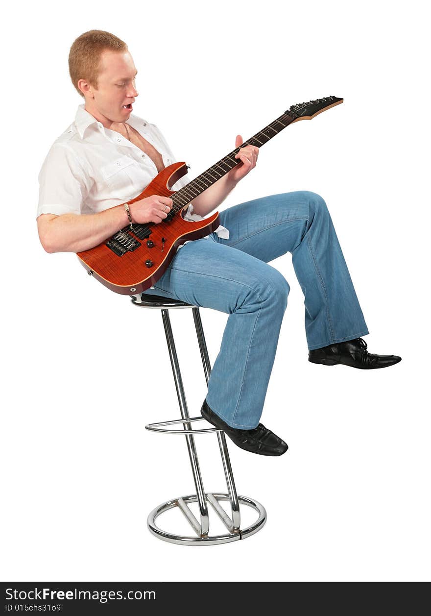 Young man play guitar on chair on white. Young man play guitar on chair on white