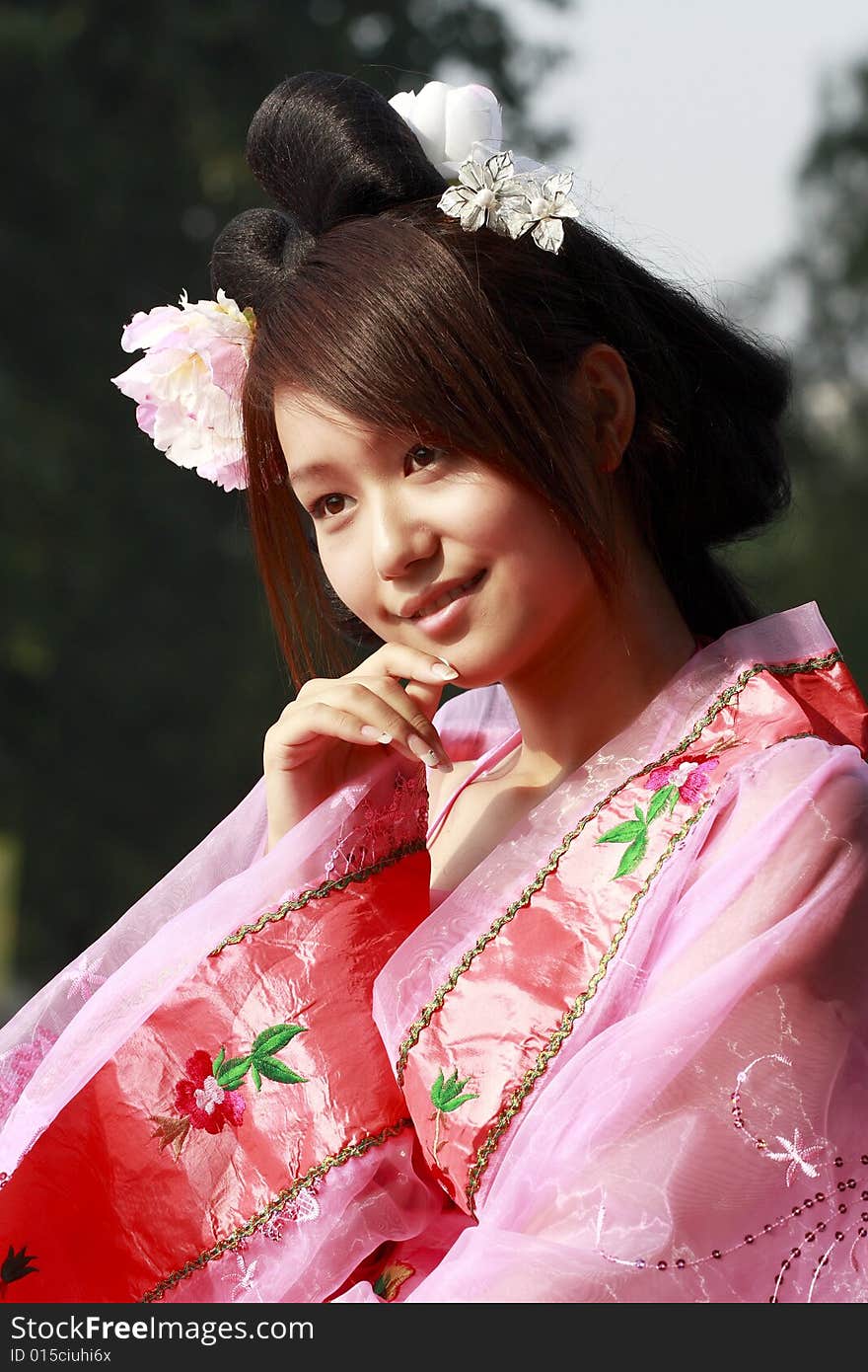 A girl in Chinese ancient dress. She is so beautiful and lovely. A girl in Chinese ancient dress. She is so beautiful and lovely