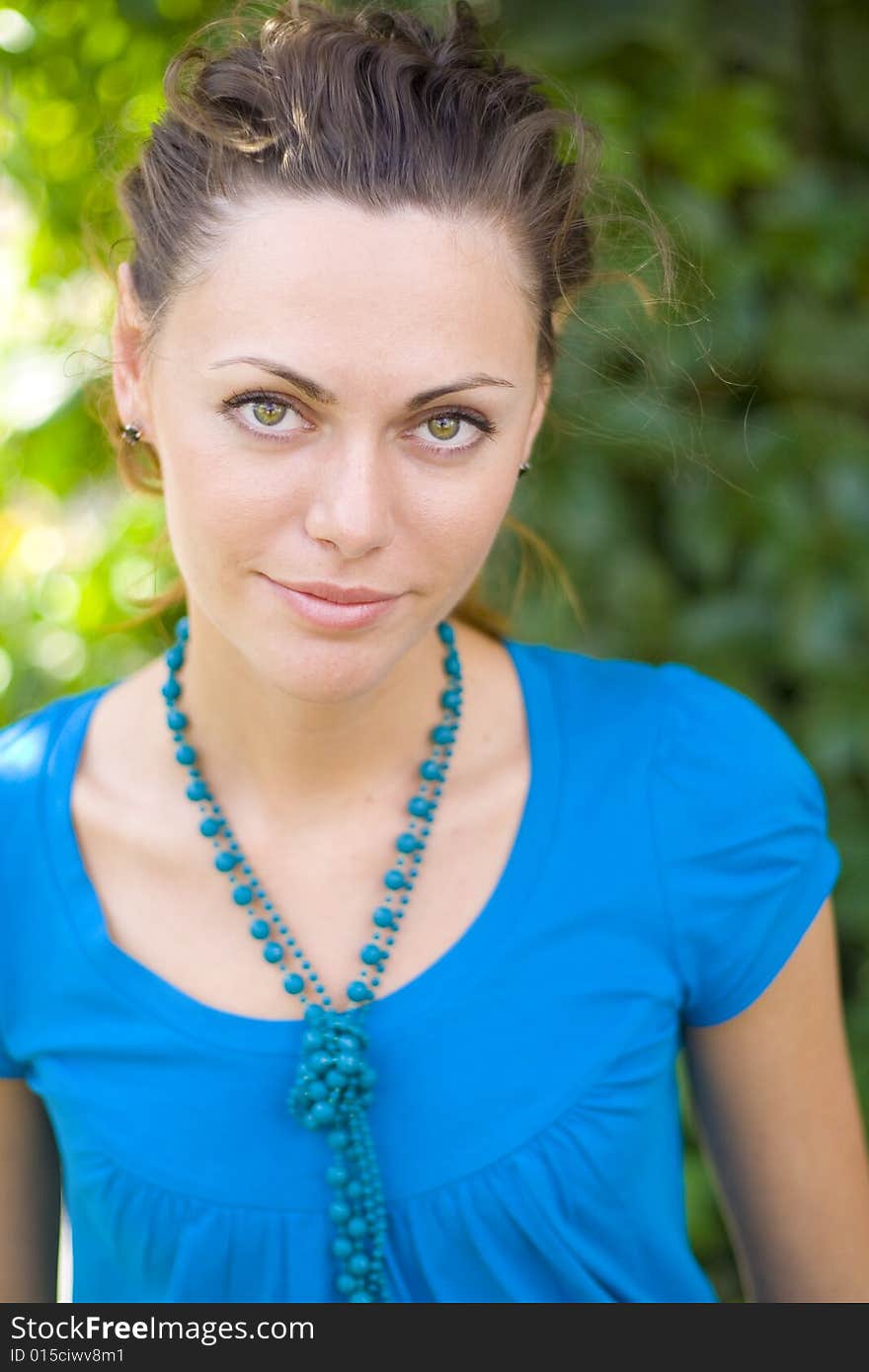 Smiling woman with blue beads. Smiling woman with blue beads