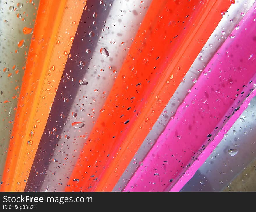 Water Drops over a coloured inflatable mattres