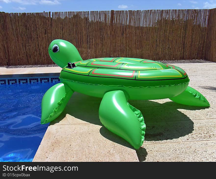 Inflatable turtle near the pool at summer in Spain. Inflatable turtle near the pool at summer in Spain