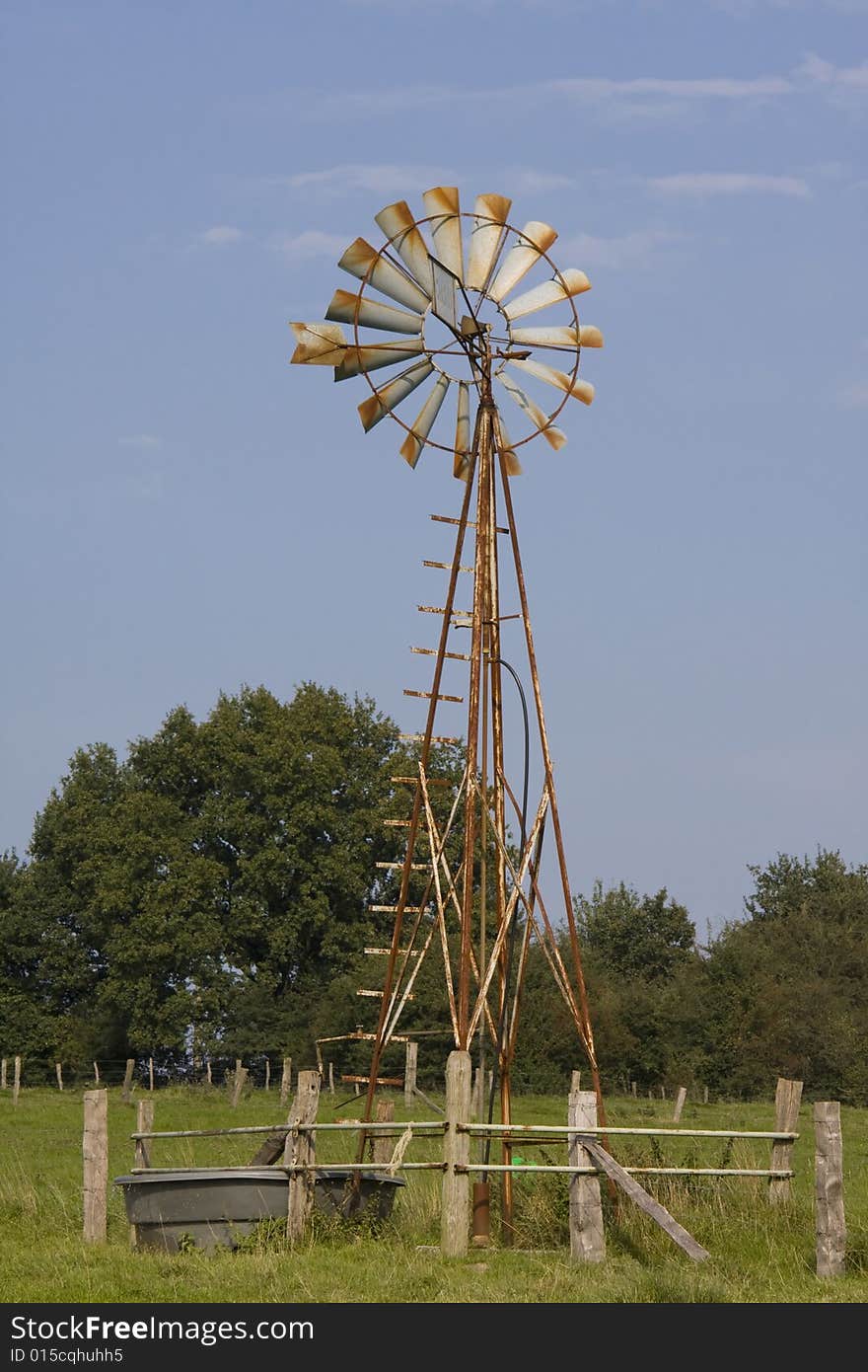 Water pumping windmill as might be seen in a field. Water pumping windmill as might be seen in a field