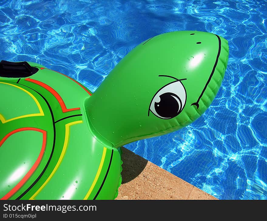 Inflatable turtle near the swimming-pool. Inflatable turtle near the swimming-pool