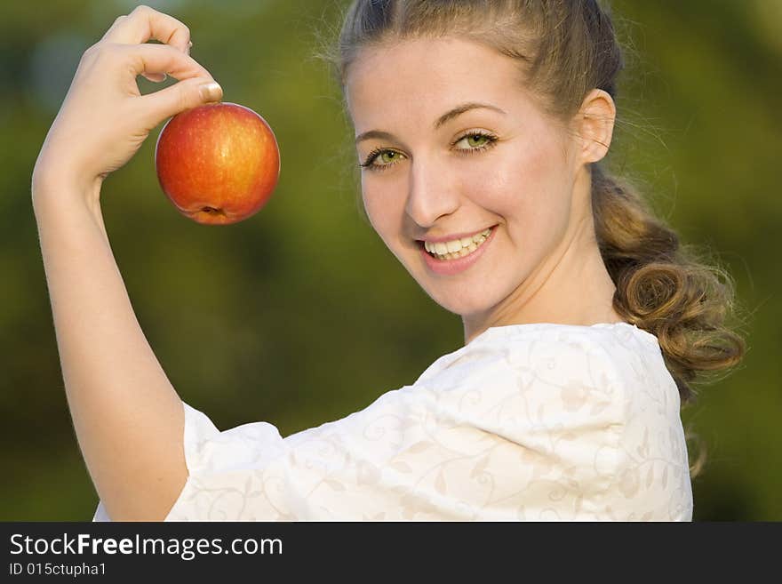 Smiling woman with red apple. Smiling woman with red apple