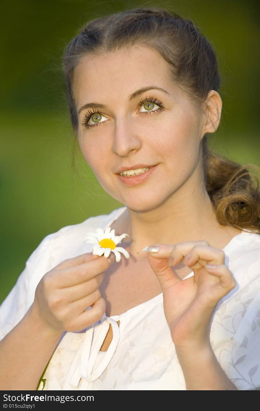 Beauty woman conjecture with chamomile. Beauty woman conjecture with chamomile