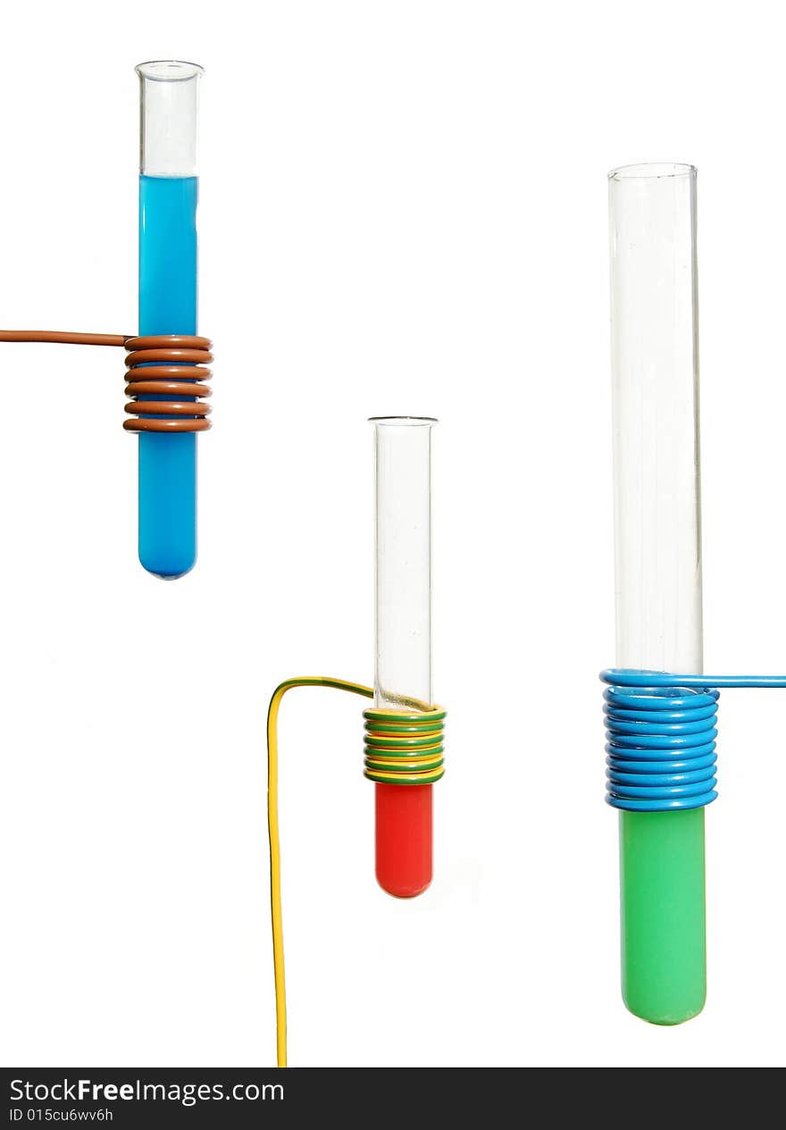 Three test tubes with liquid on white background