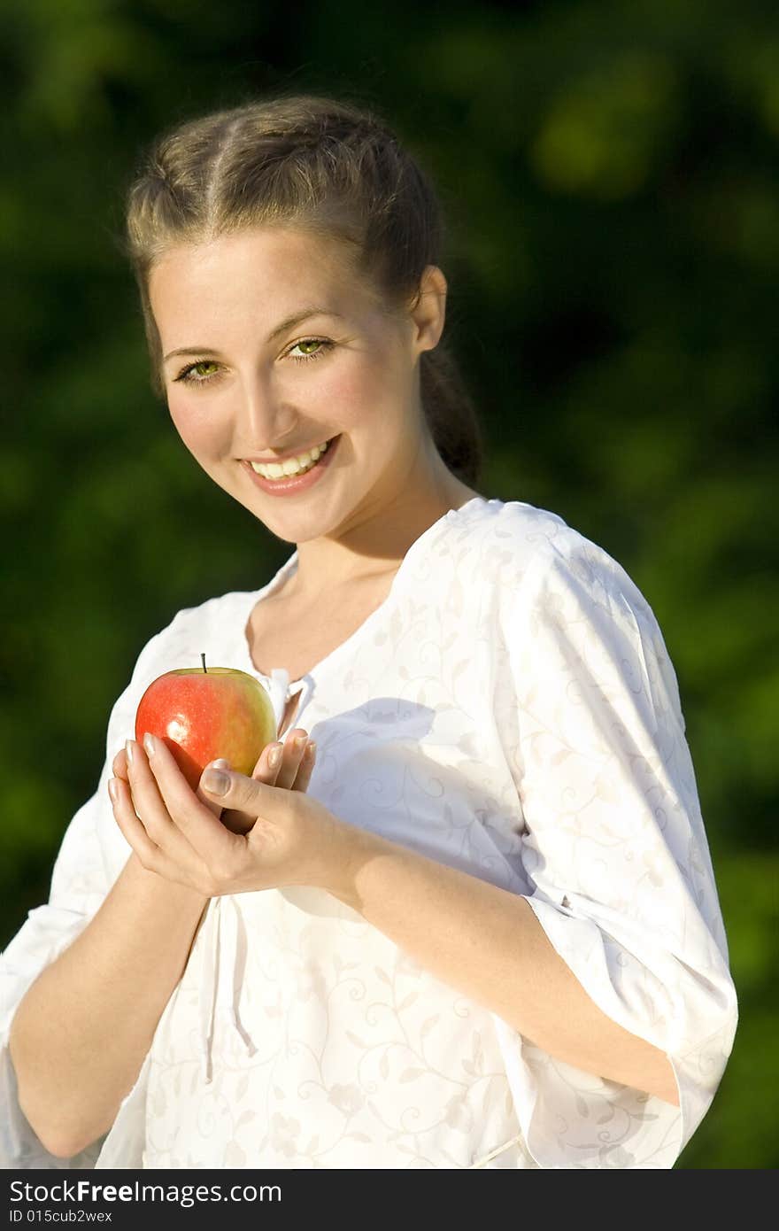 Smiling woman with red apple. Smiling woman with red apple