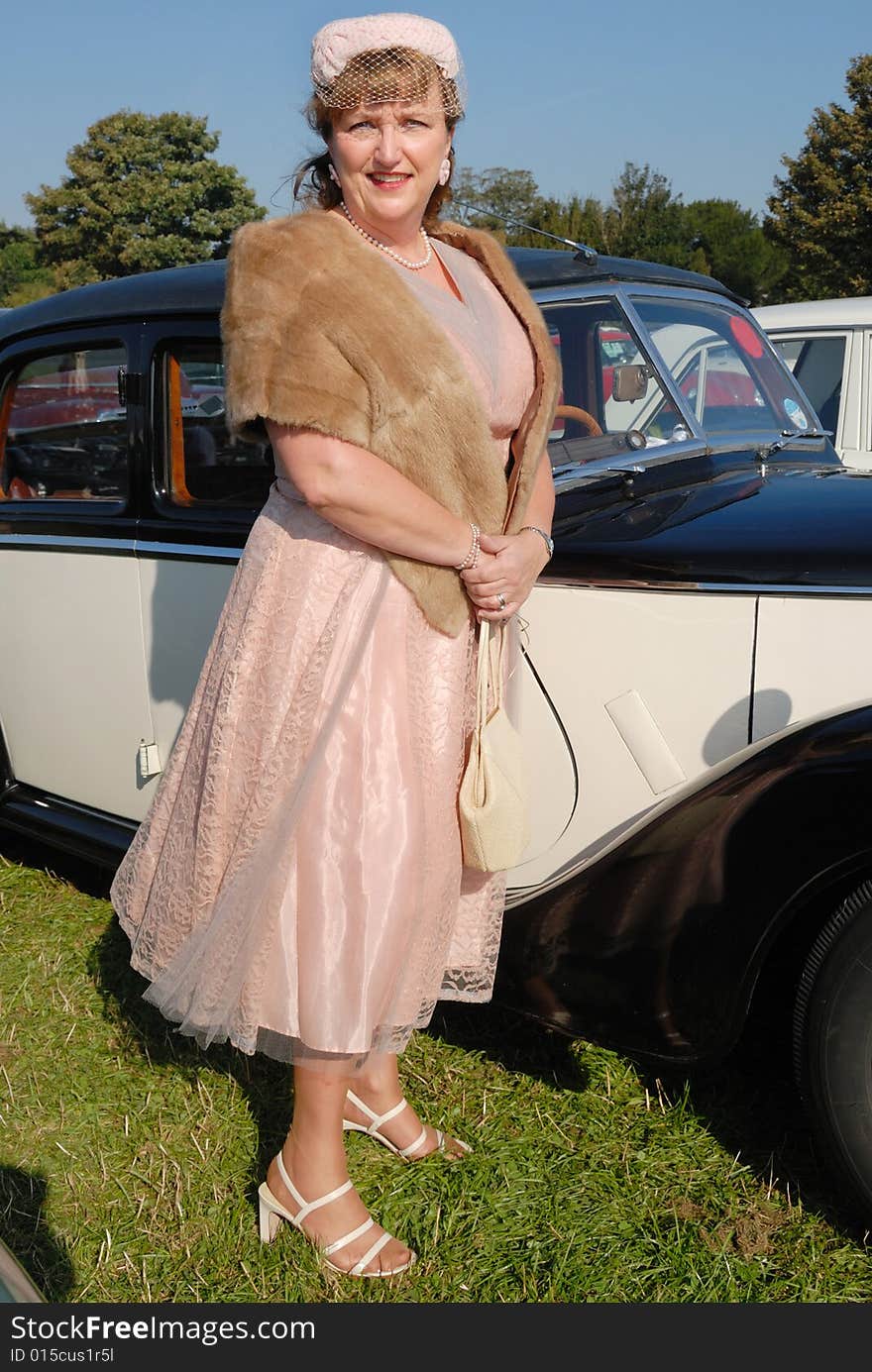 Lady in retro vintage costume at Goodwood Revival event, UK. Lady in retro vintage costume at Goodwood Revival event, UK