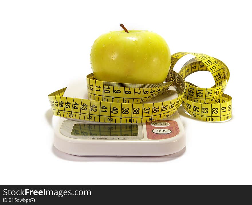 Green apple, scale and tape measure isolated. Green apple, scale and tape measure isolated