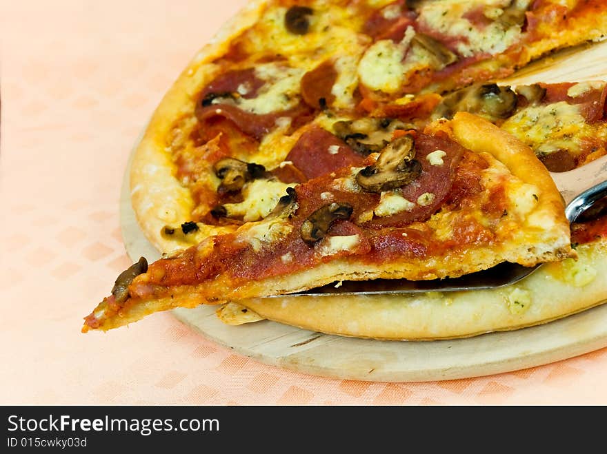 A pizza with cheese,salami - slices