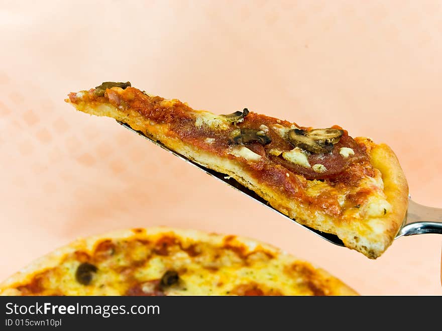 A pizza with cheese,salami - slices