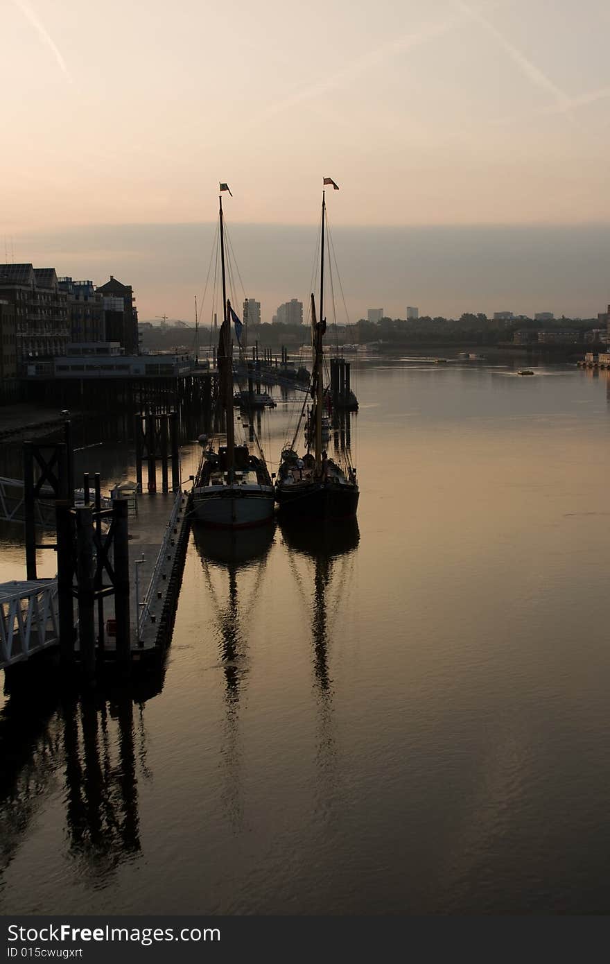 Sail Boats Reflecting Into The Thames