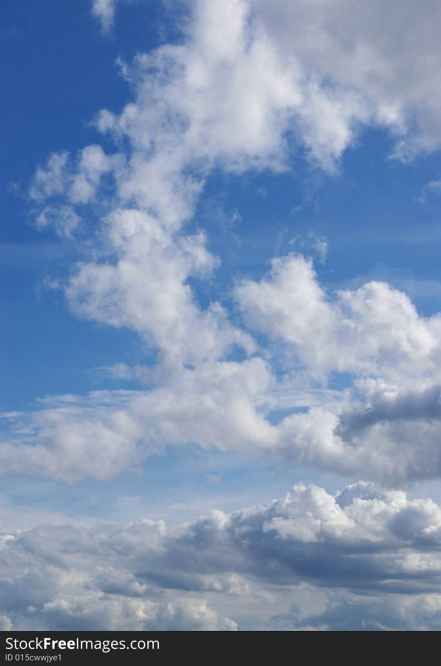 White clouds in a blue sky. Great background. White clouds in a blue sky. Great background