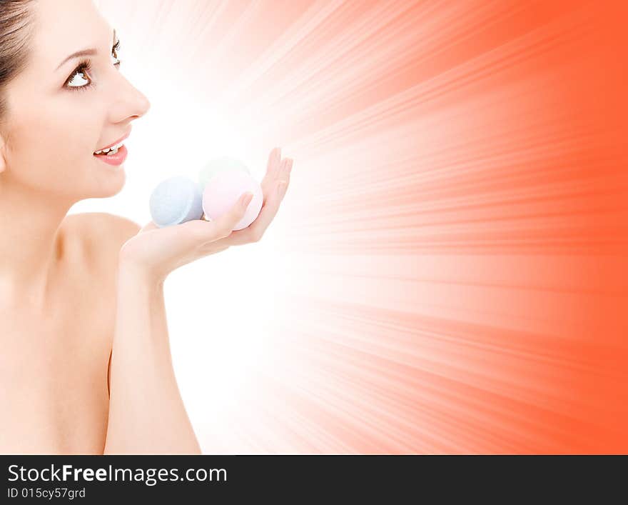 Woman with aromatic balls for spa