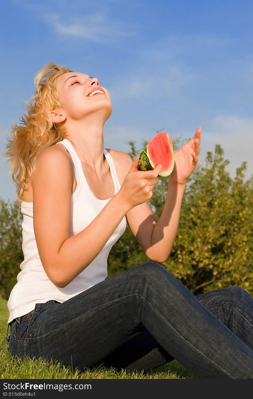 Blonde Eats Watermelon In The Park