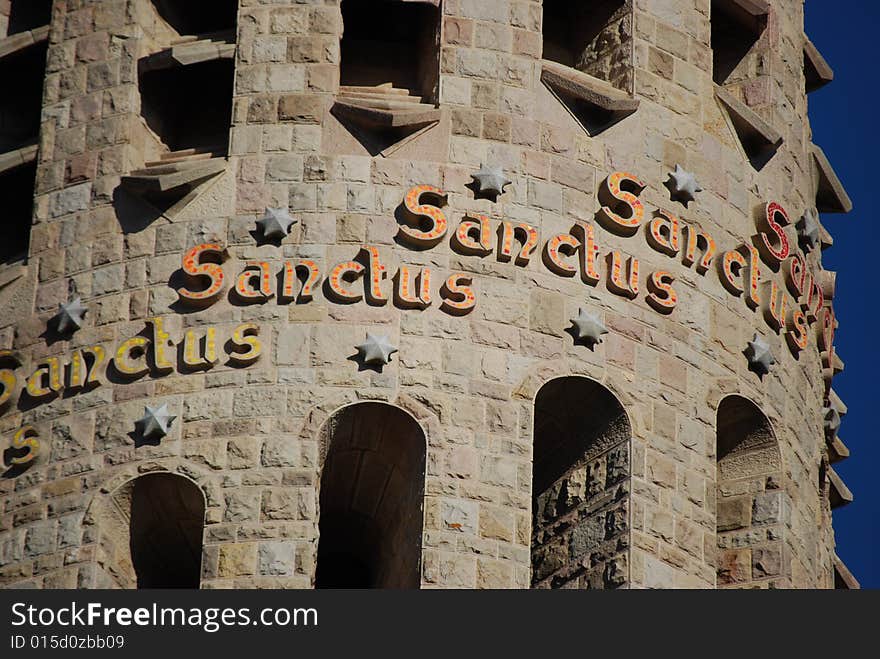 The Sanctus text on Familia Sagrada cathedral in Barcelona, Spain. The Sanctus text on Familia Sagrada cathedral in Barcelona, Spain.