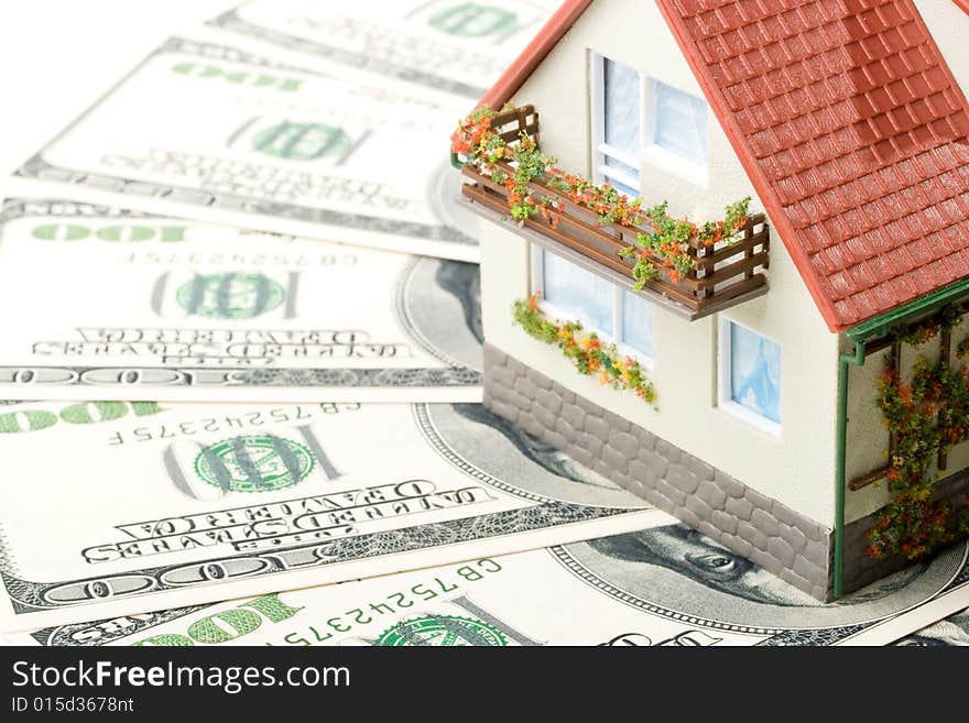 Miniature House and Money. Buying house concept