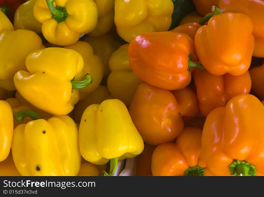 A selection of orange and yellow bell peppers