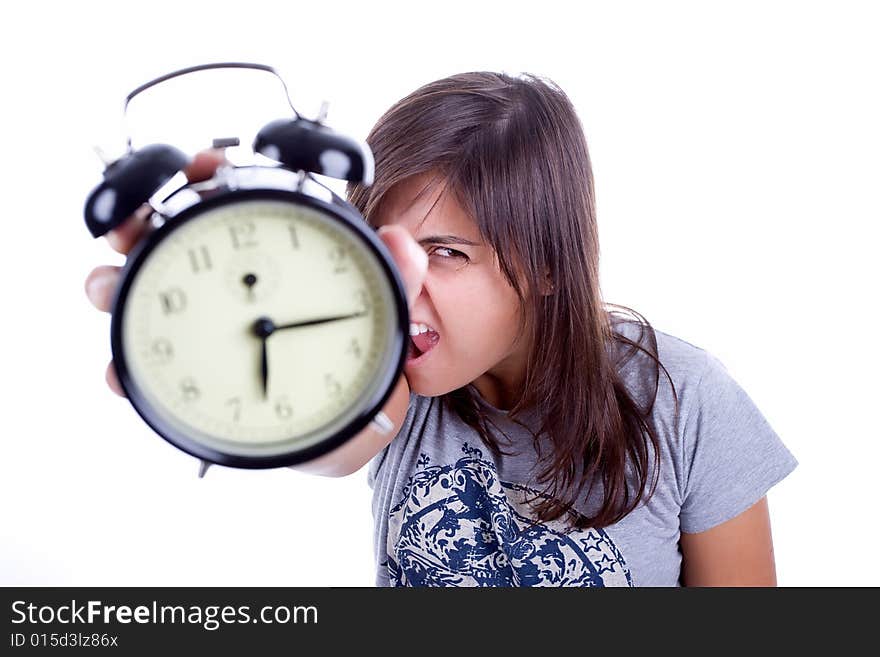 Young woman with alarm clock screaming isolated in white background