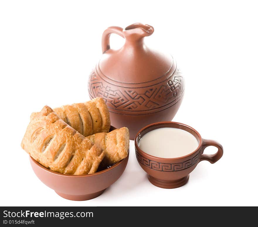 Pie, jug and cup of milk