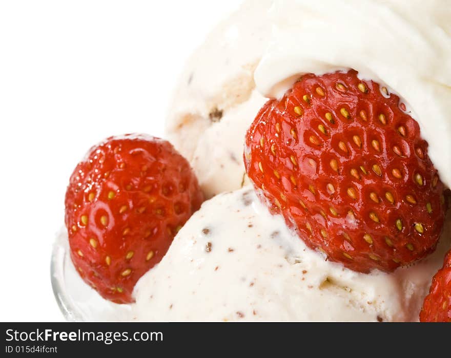 Ice-cream with a strawberries in a glass on a white background.