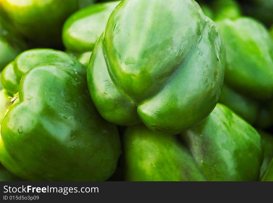 A closeup of a basket of green peppers. A closeup of a basket of green peppers