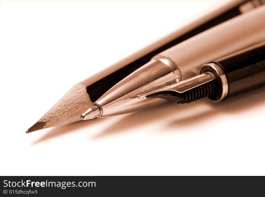 Pencil, pen and fountain pen isolated over white. Pencil, pen and fountain pen isolated over white