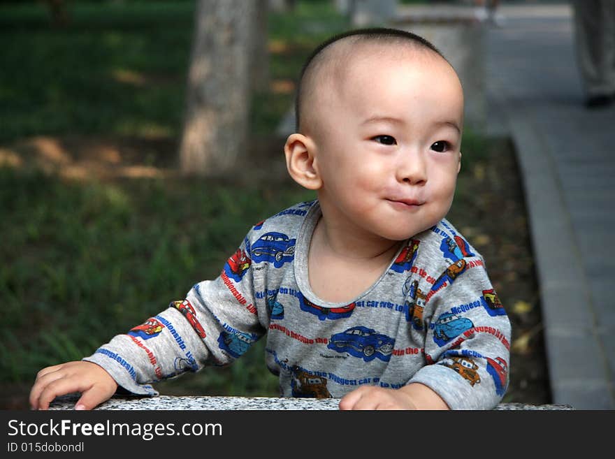 Smile baby boy in the park.